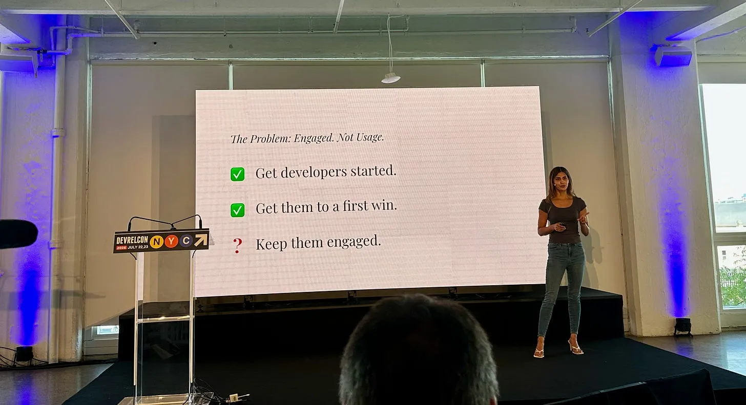 Nikita Jotwani presenting a slide about keeping developers engaged beyond initial onboarding.